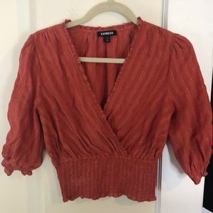 Express orange top with gold thread throughout.